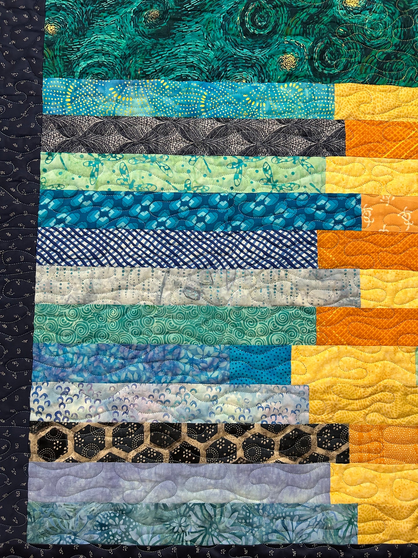 Close up of patchwork and quilting on quilted throw