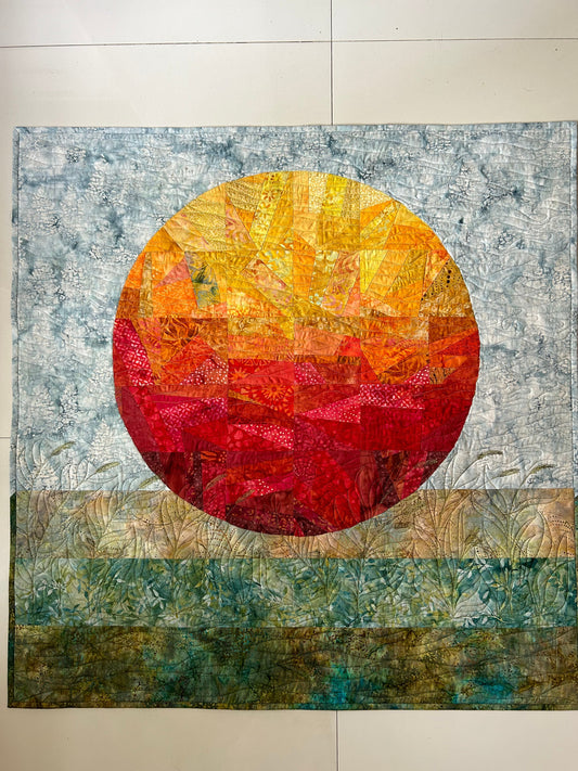 Abstract sun quilt wall hanging – full view of textile art.