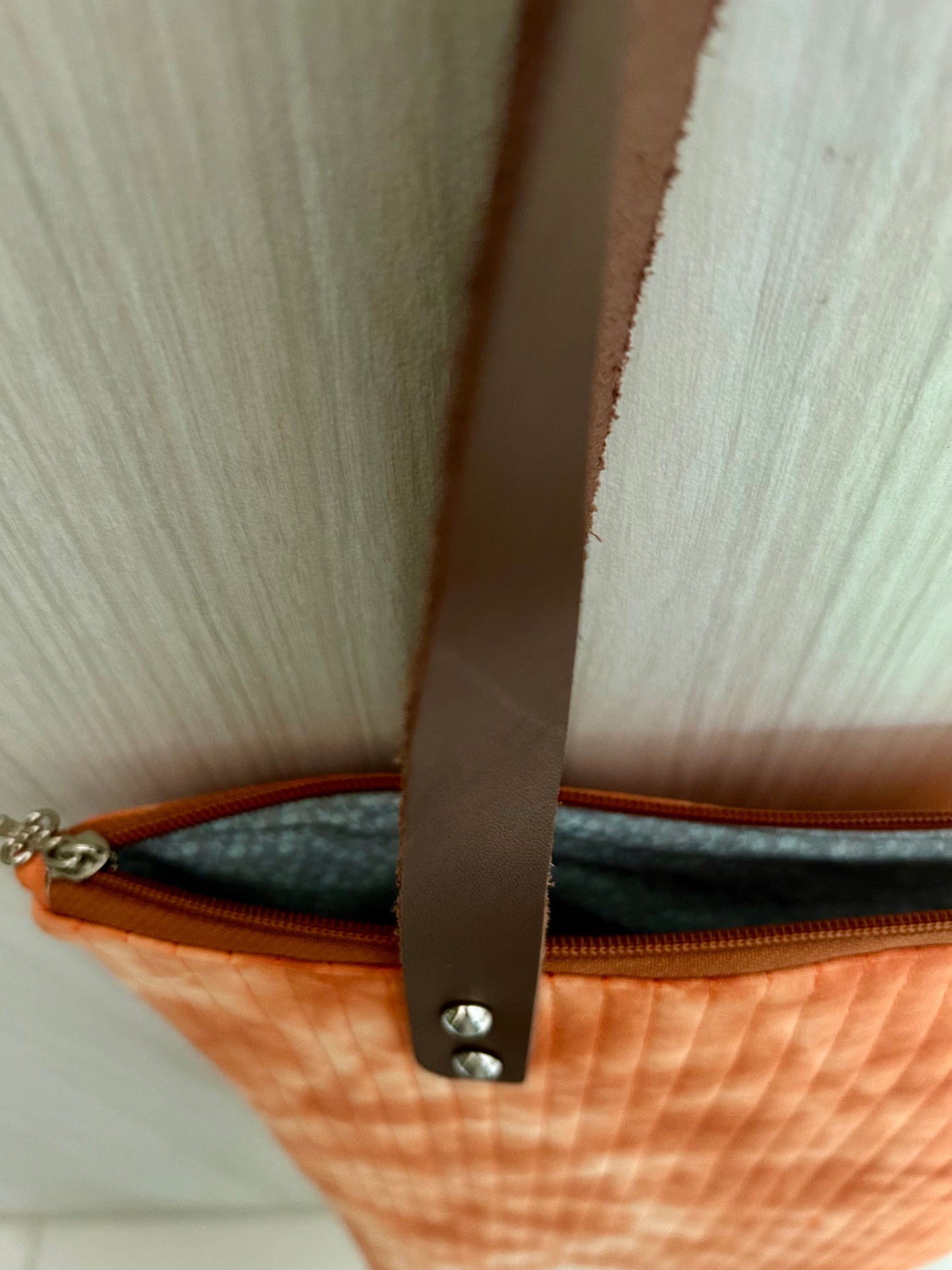 Detailed view of leather strap and stitching