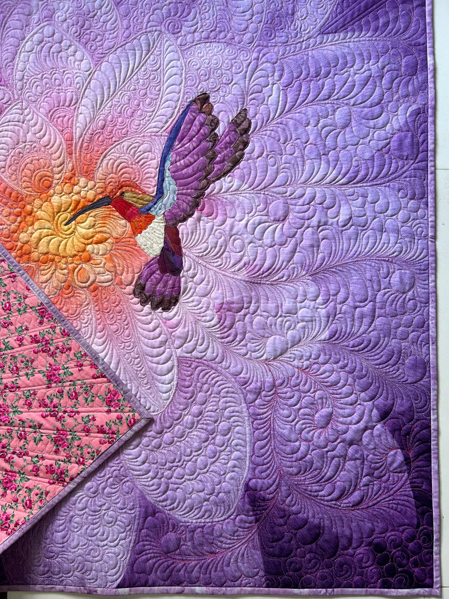 Hummingbird appliqué on Purple flower panel and details of quilting