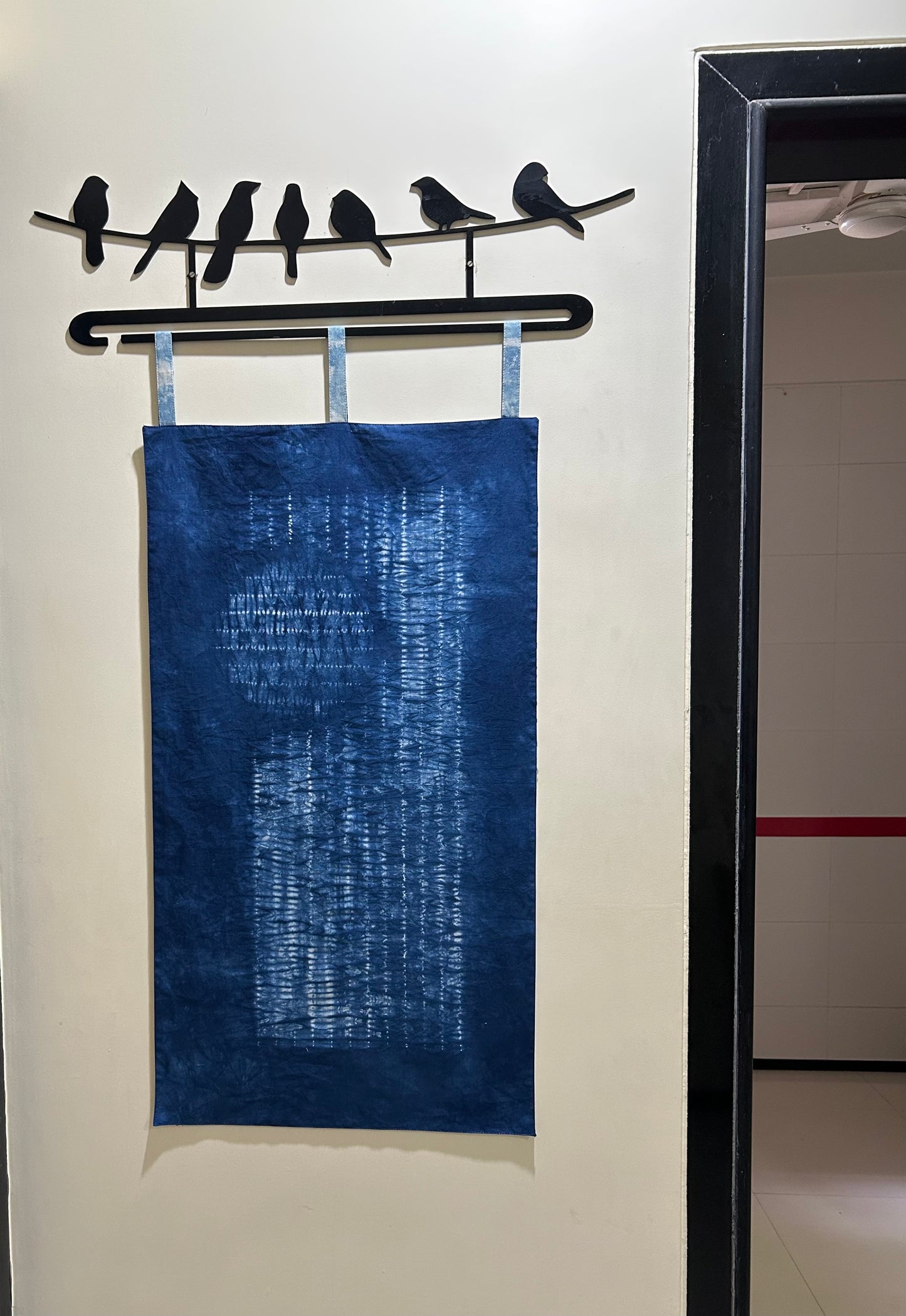 Short distant view of indigo shibori fabric hanging