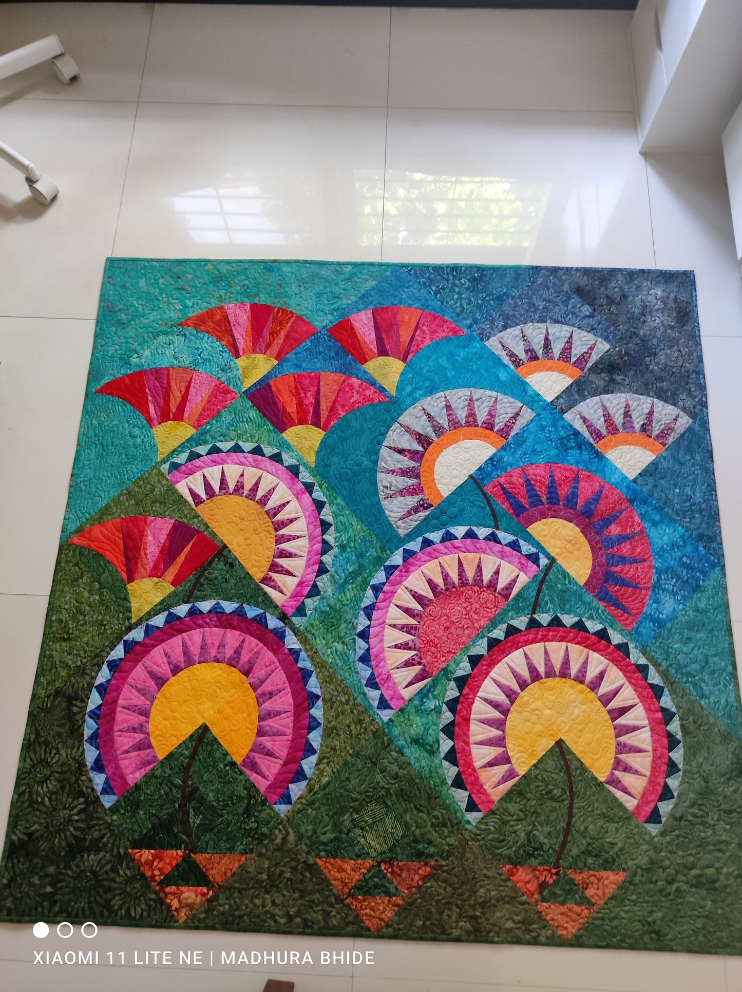 New York beauty flower garden quilt laid on the floor