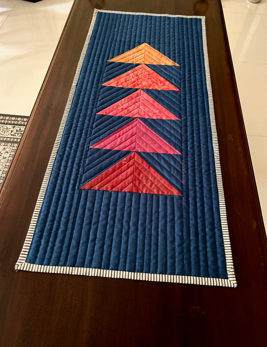Blue flying geese quilted table runner