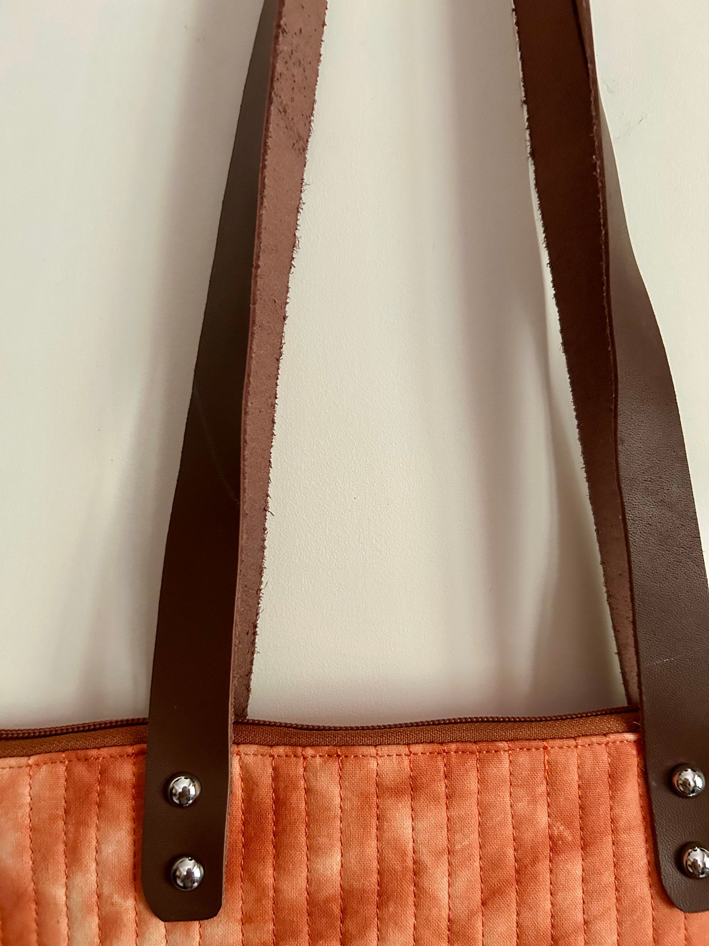 Detailed view of leather strap and stitching