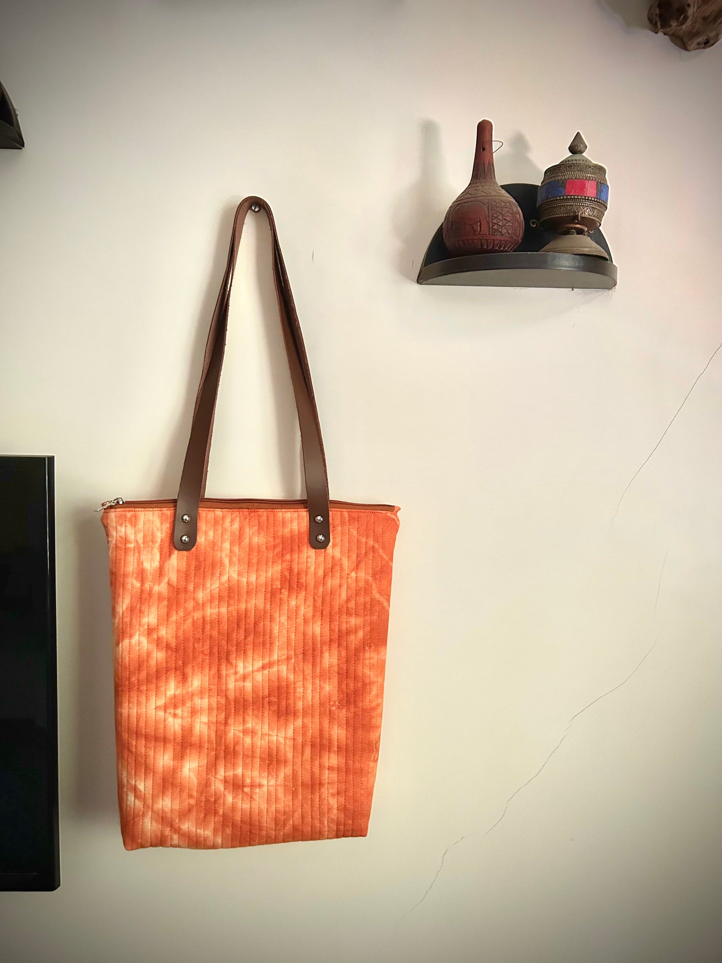 Hand-dyed rust orange quilted tote bag with leather straps