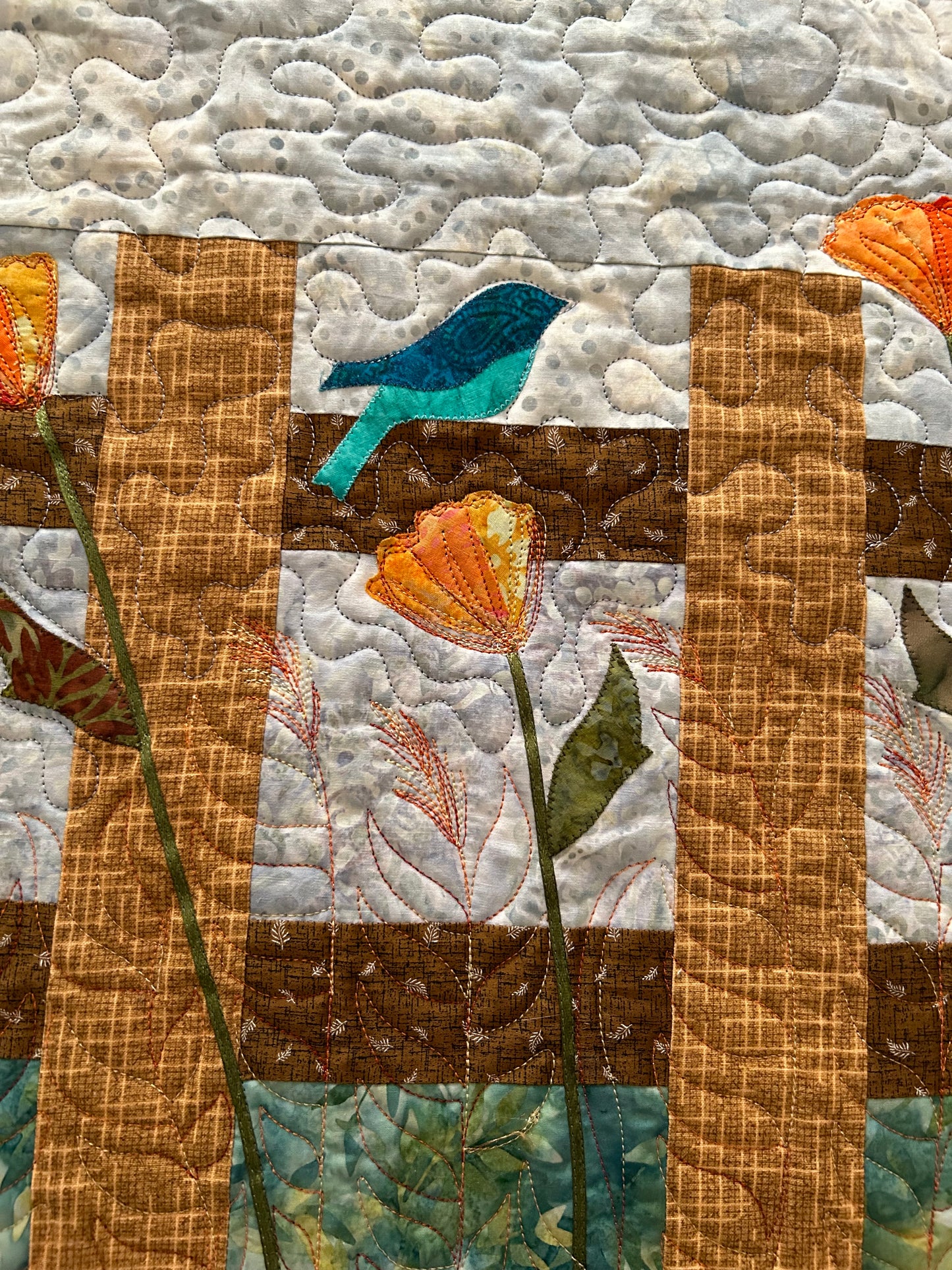 Bird and flower appliqué on table runner