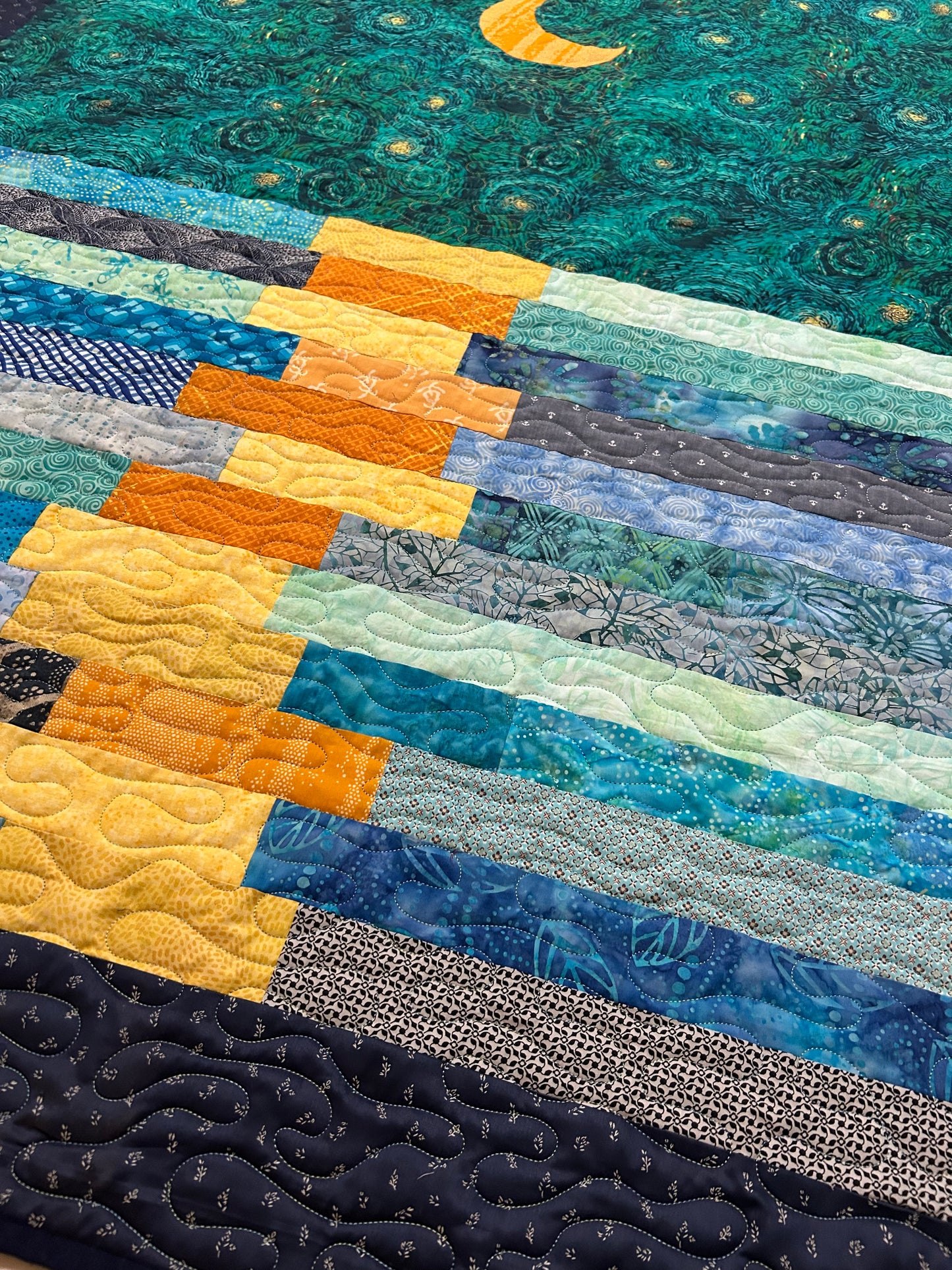 Close-up of Van Gogh-inspired patchwork on quilt