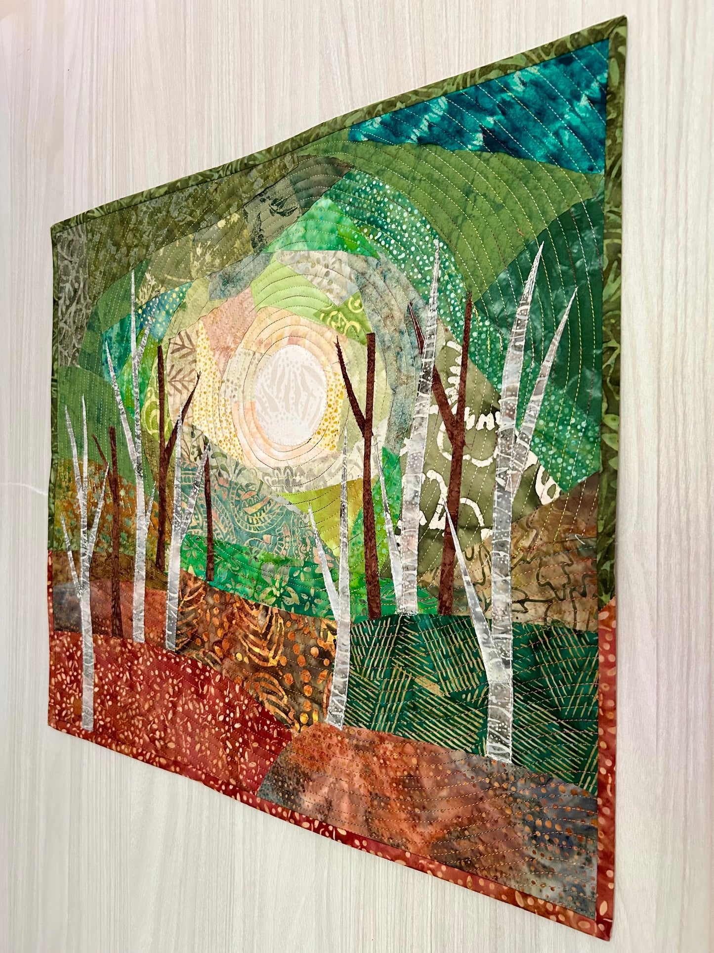Side view of landscape art quilt