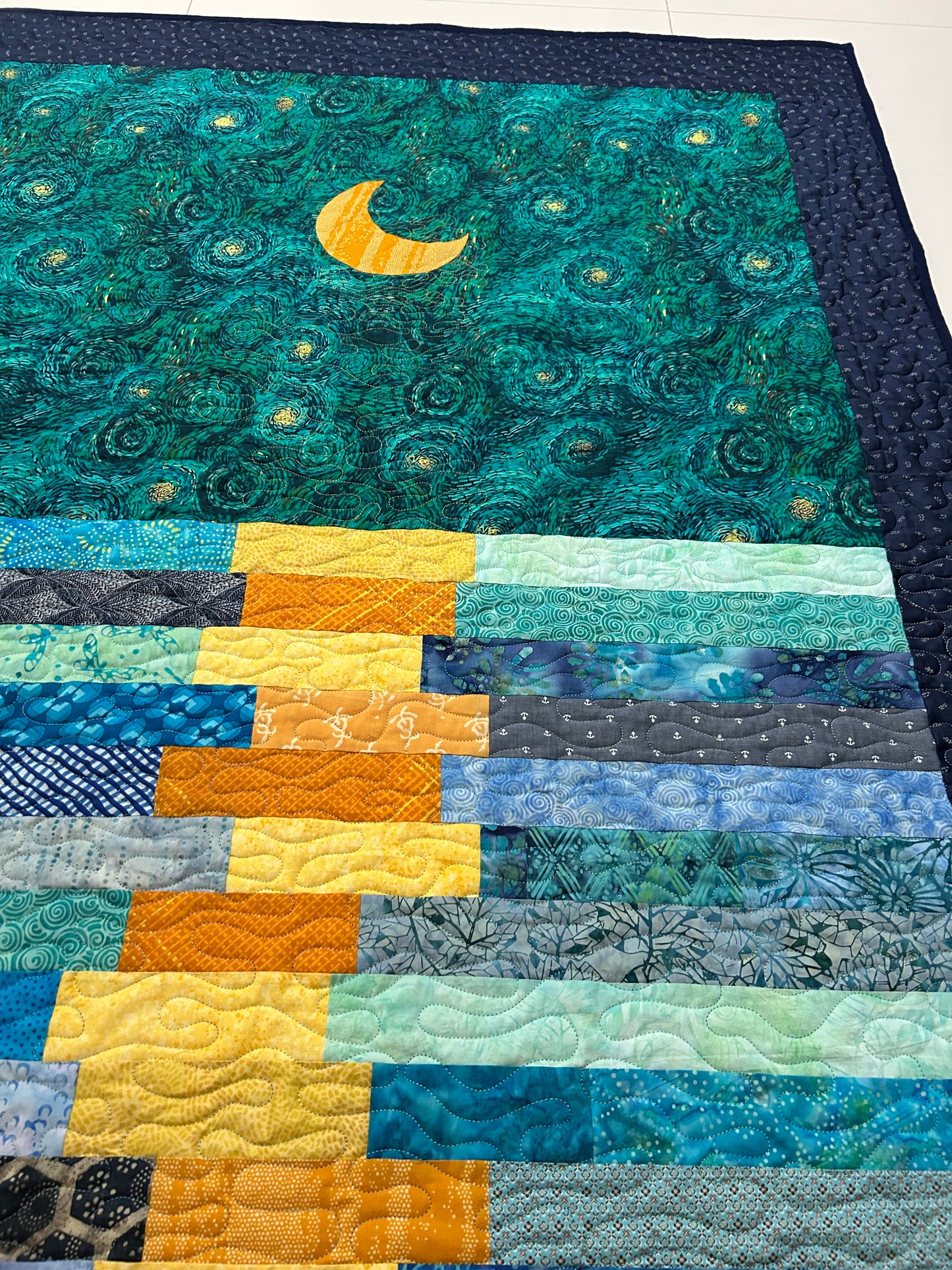 Quilted swirls on starry night quilt
