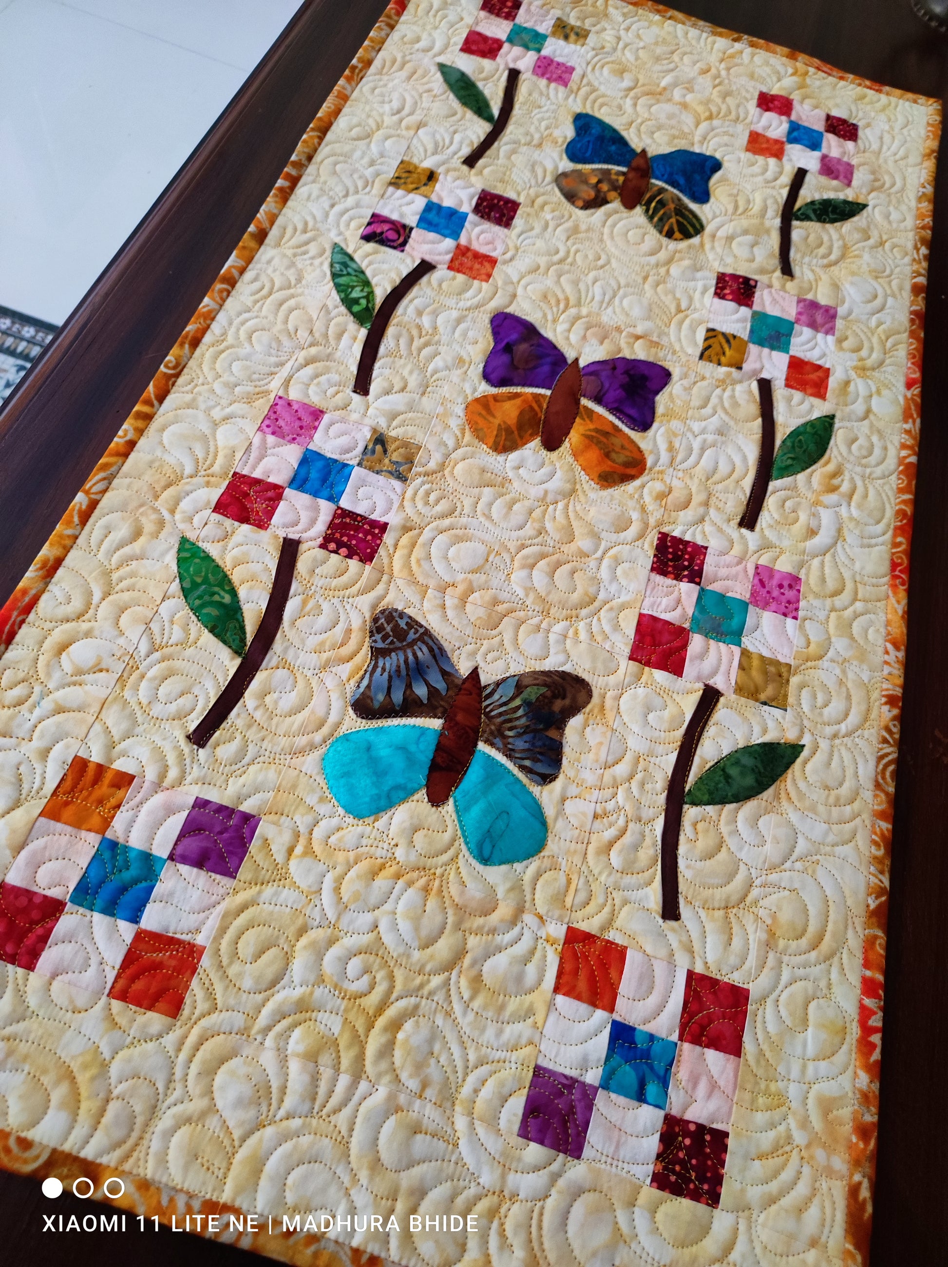 Side view of butterfly quilted table runner