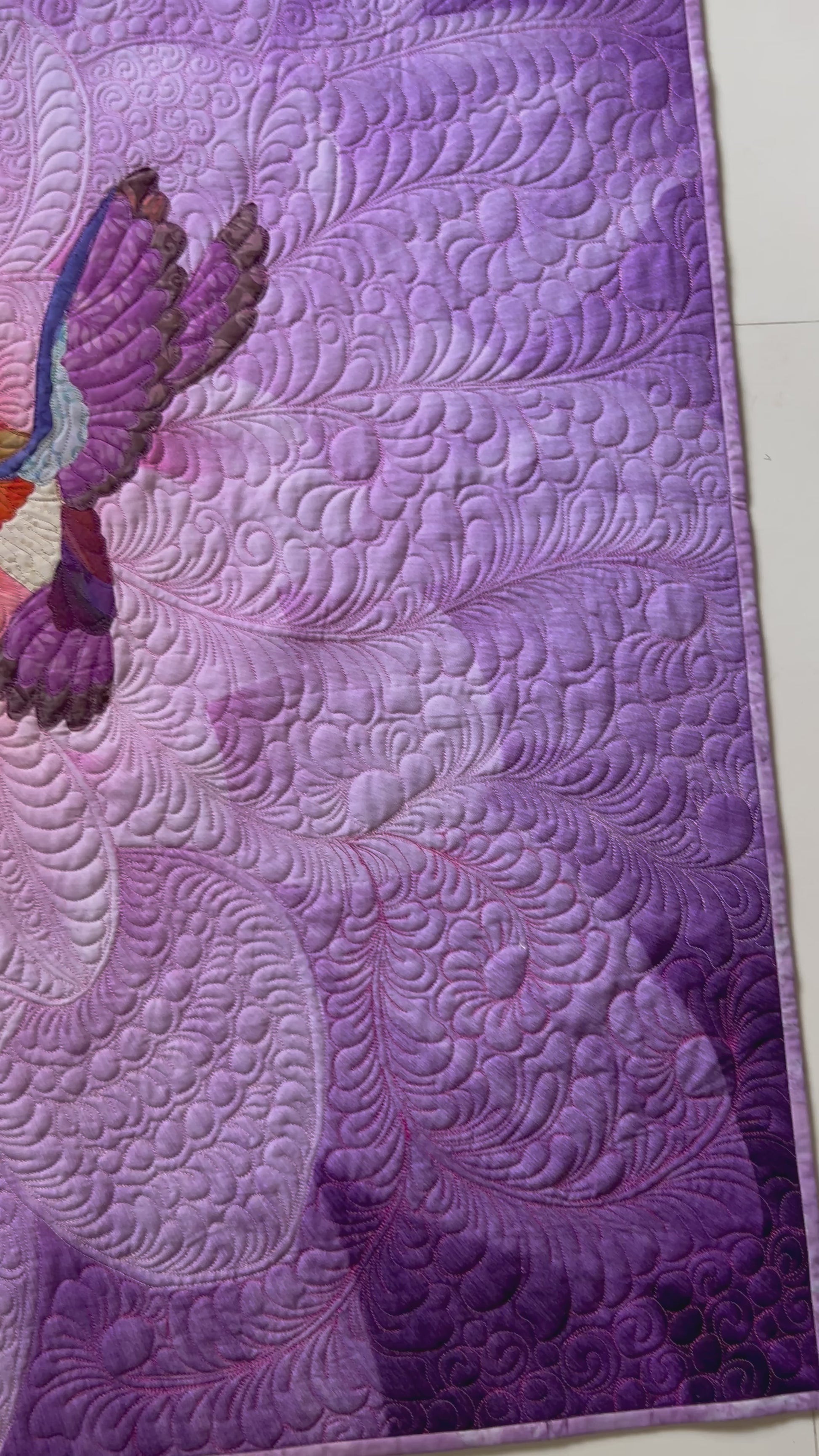 Video showing all details of purple floral art quilt.