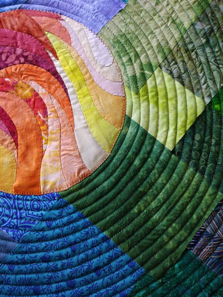 Details of quilting lines on space wall art quilt