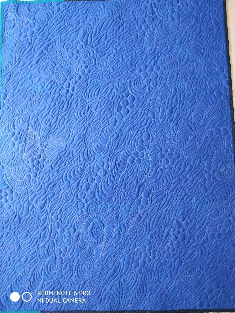 Backside of the blue art quilt