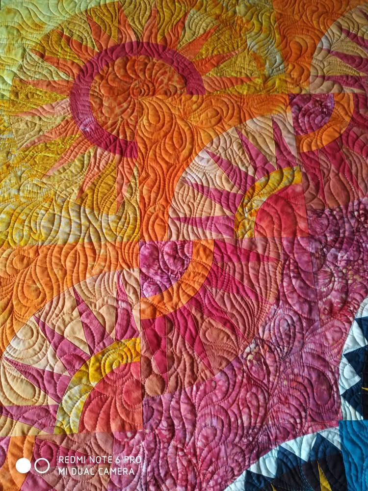 Close up of blocks on sunrise quilt