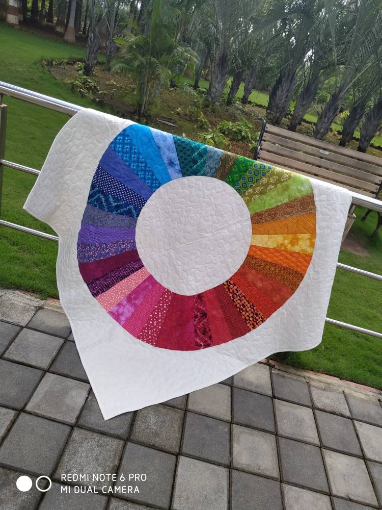 Vibrant modern lap quilt in natural lighting