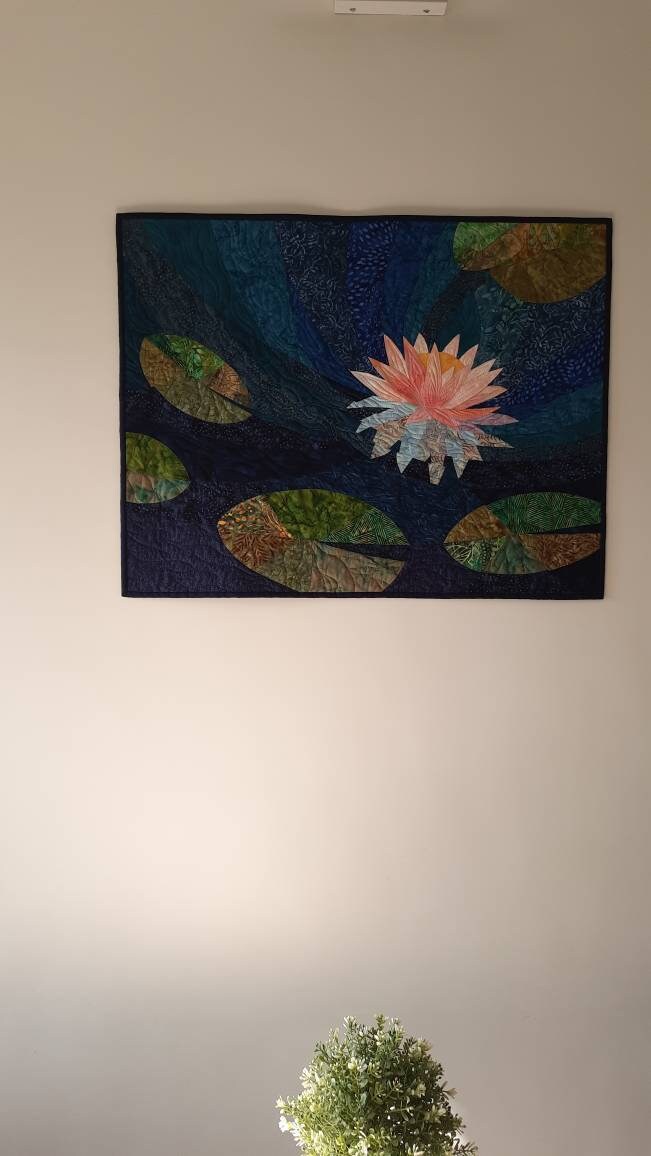 Lotus art quilt on wall