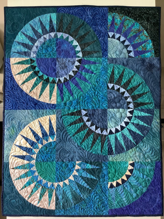Handmade textile wall hanging with traditional New York Beauty pattern.