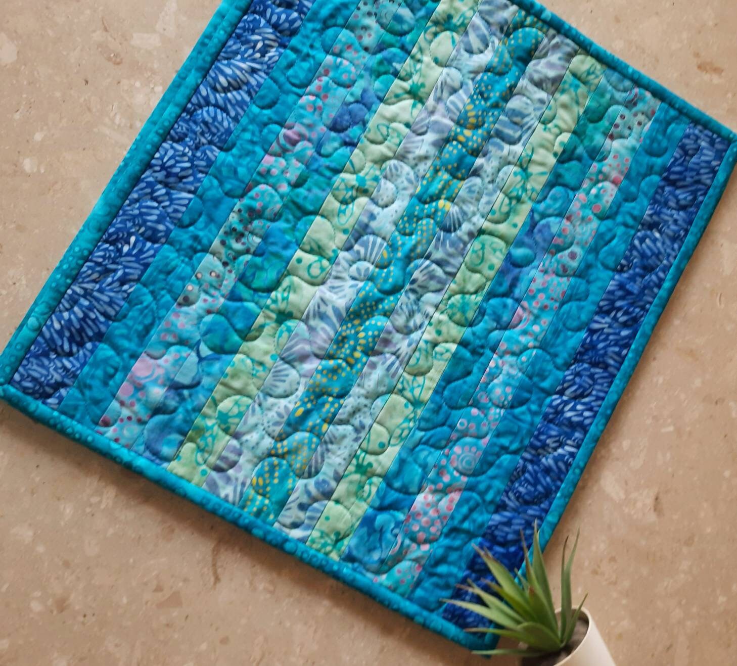 Flat-lay of batik cotton table mats in natural light