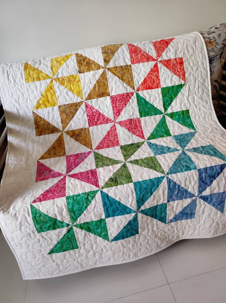 Side view of colourful baby quilt