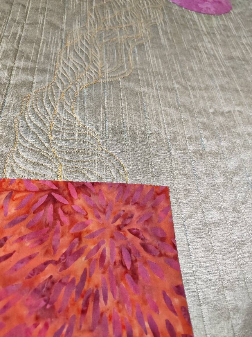 Side angle showing layered quilting and silk sheen of the moon quilt