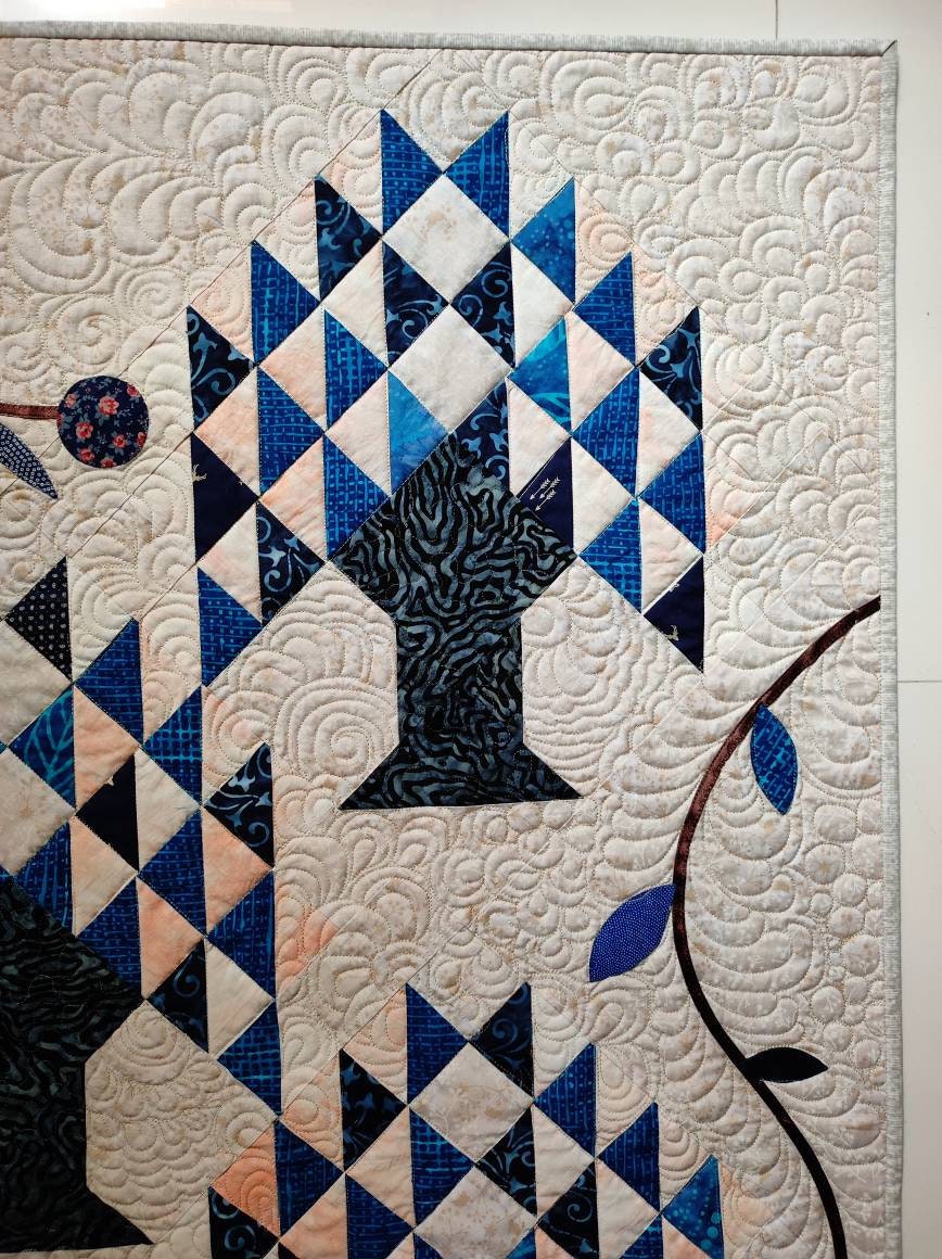 Corner of tree of life blue and cream quilt