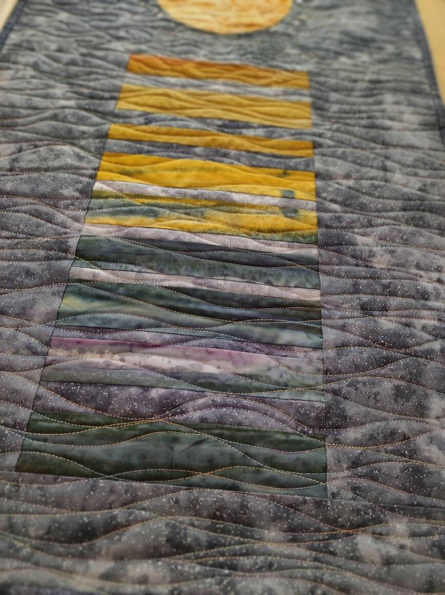 Quilting details on lunar wall art