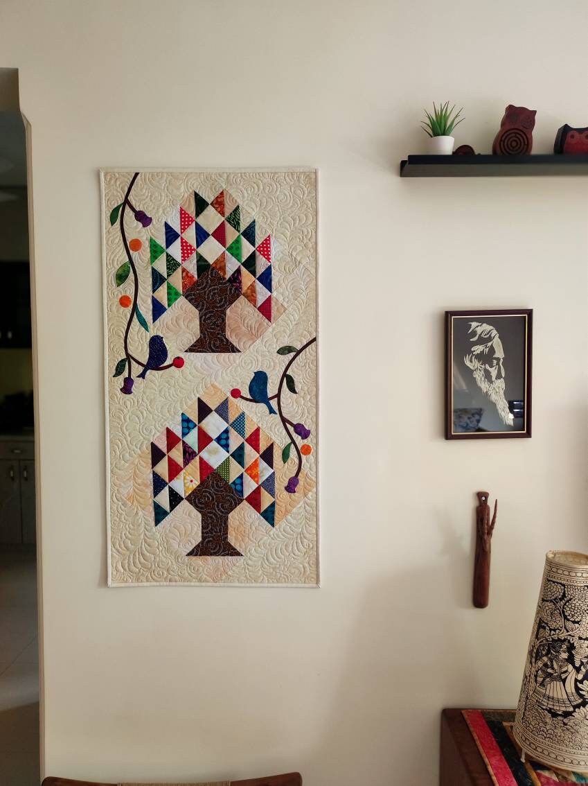 Small tree of life multicolour quilt on wall