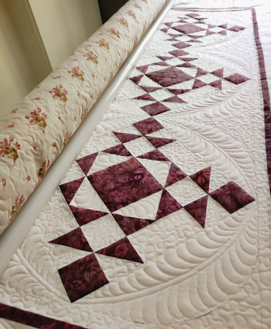 Wine colour full size quilt on my long arm machine in making