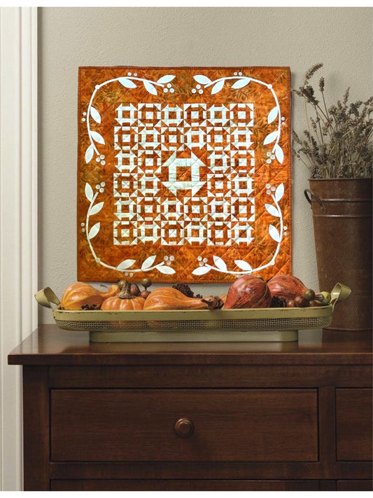 Quilt hanging as wall art in rustic decor setup