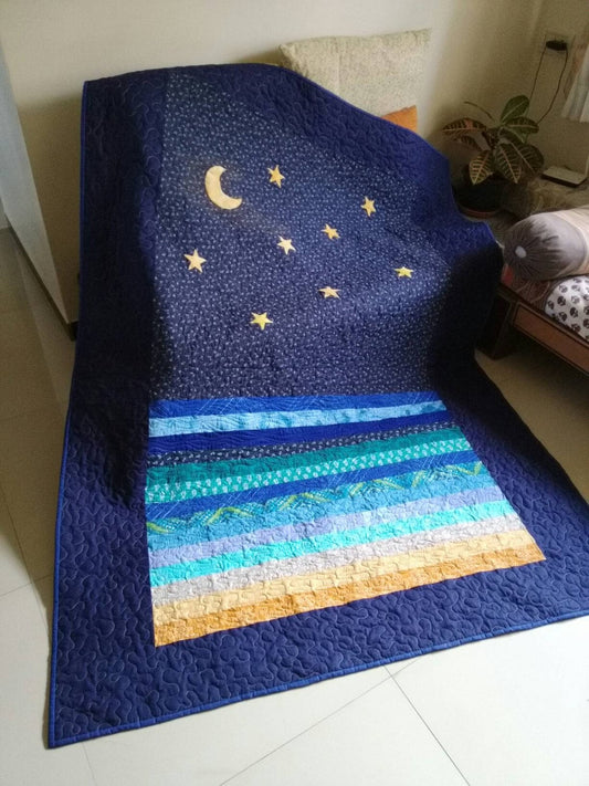 Handmade ocean-inspired moon quilt in full size – modern blue tones.