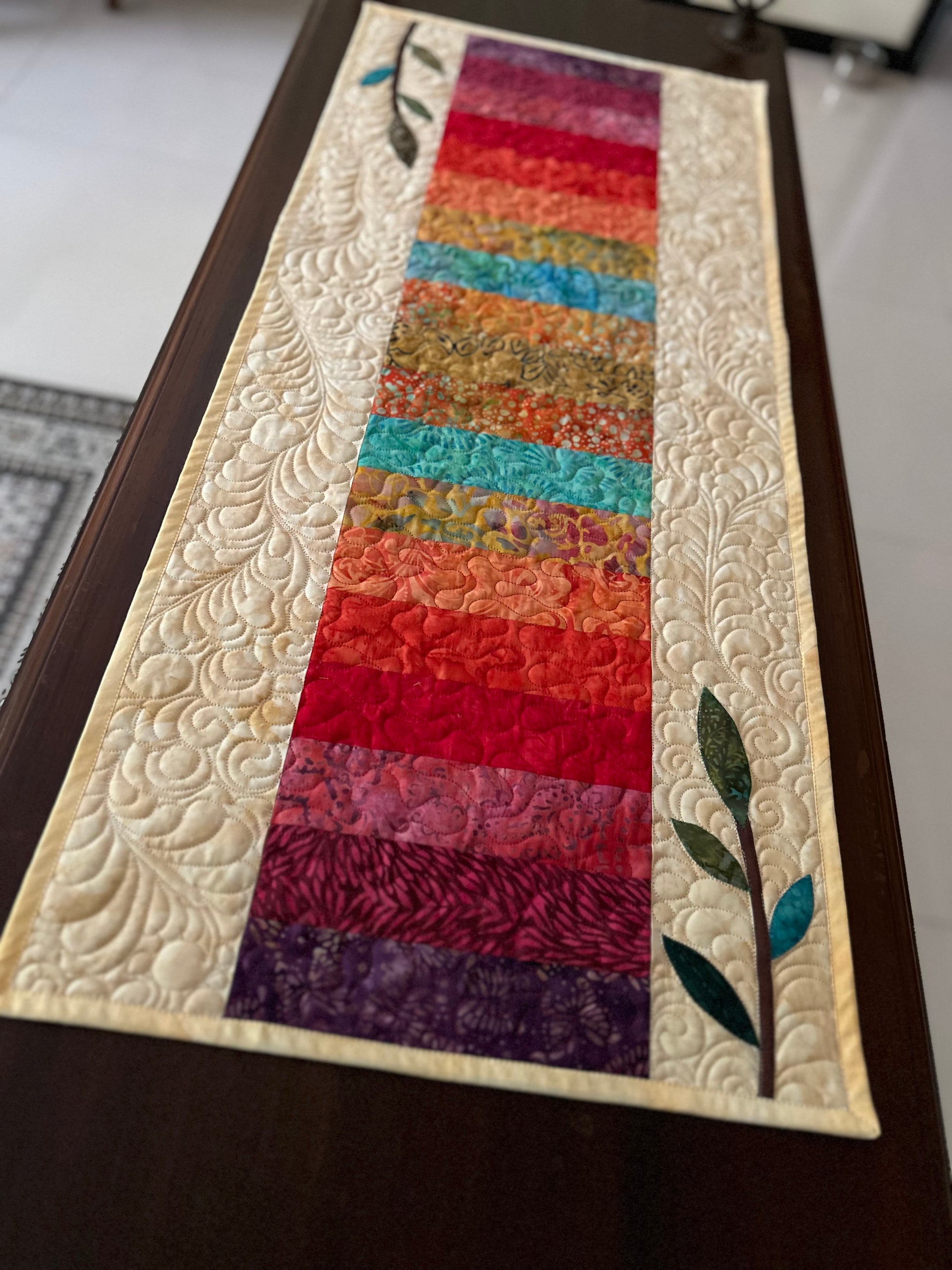 Handmade Rainbow Batik Quilted Table Runner on dining table