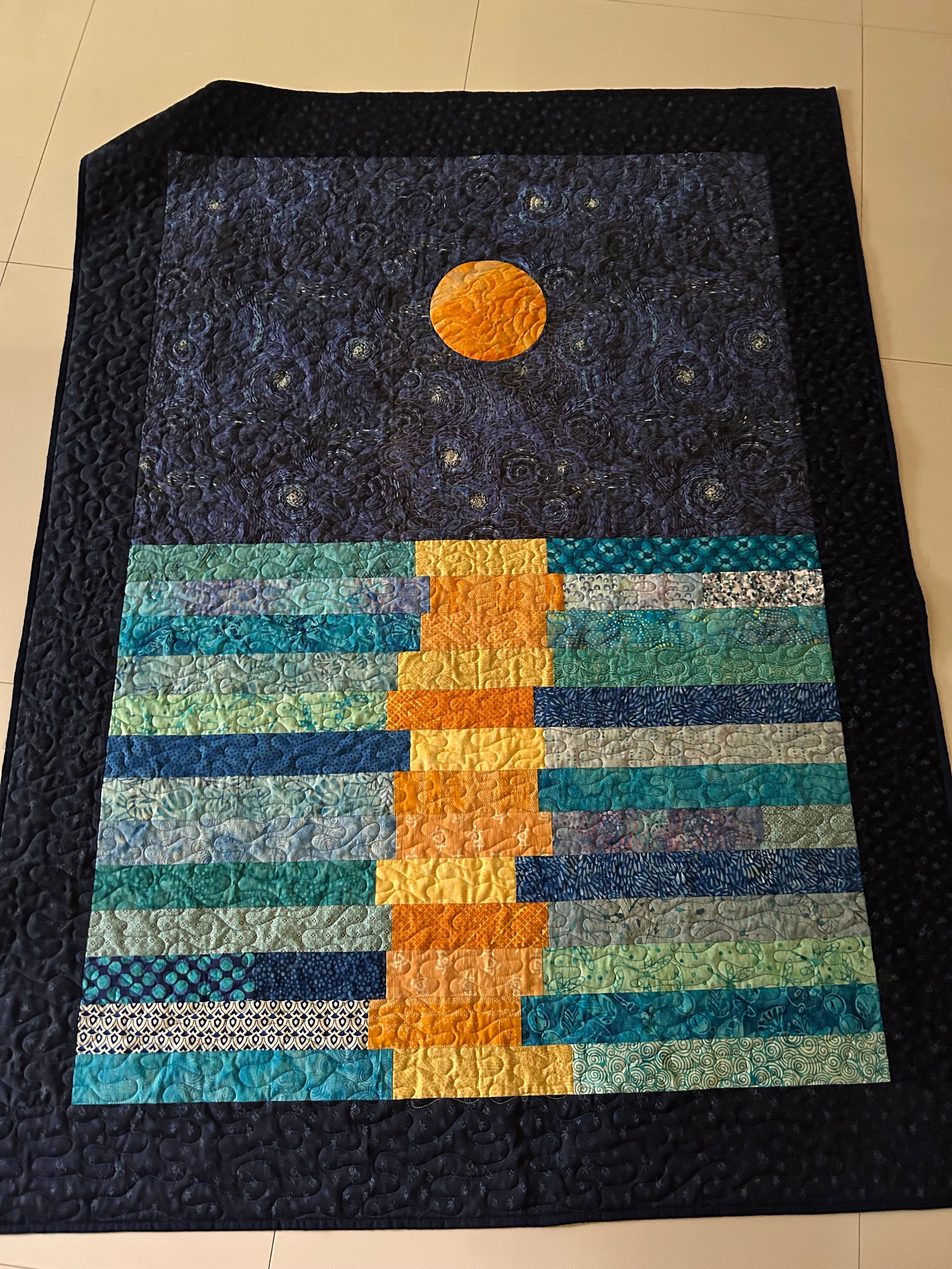 Van Gogh inspired throw quilt on the floor