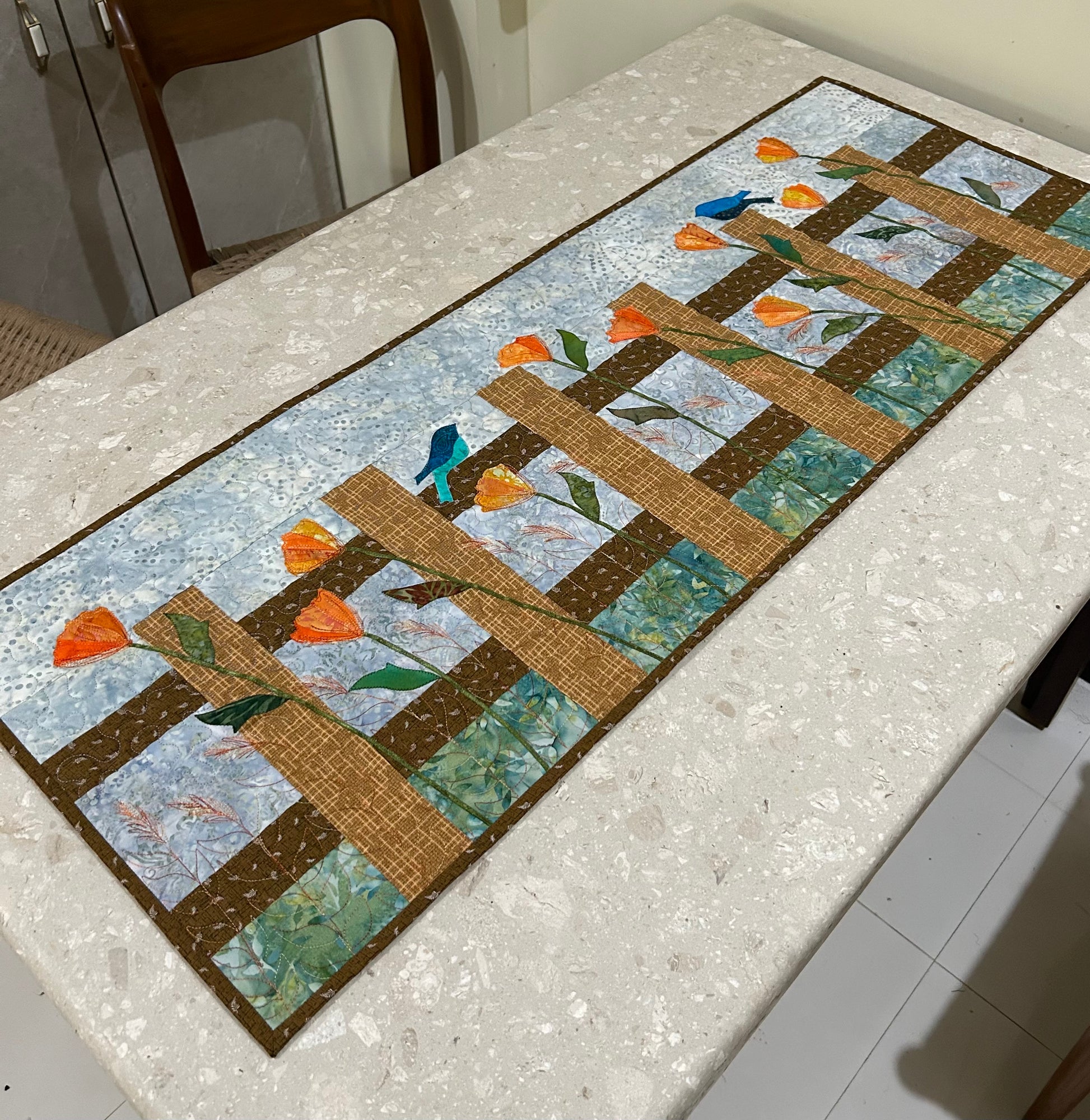 Handmade floral quilted table runner with fence flower design