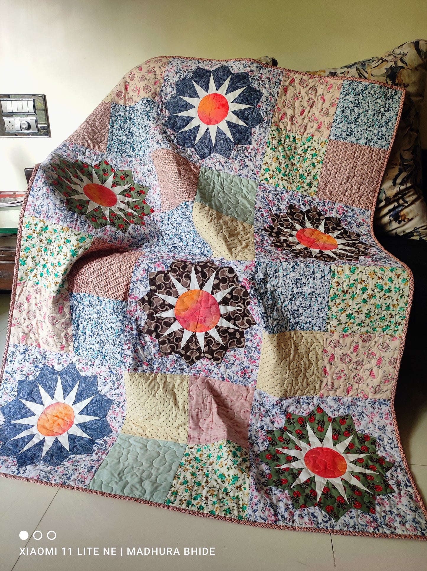 Quilted sofa throw with Dresden plate blocks 
