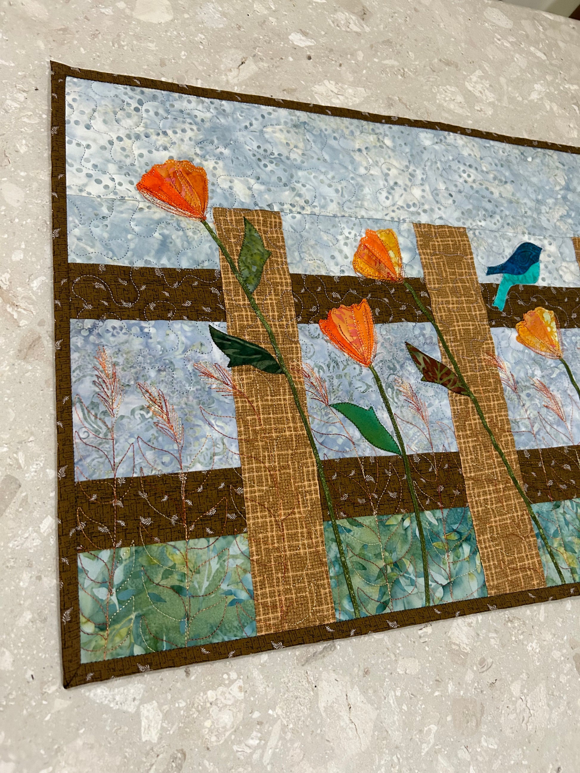 Quilting details on fence design quilted table runner 