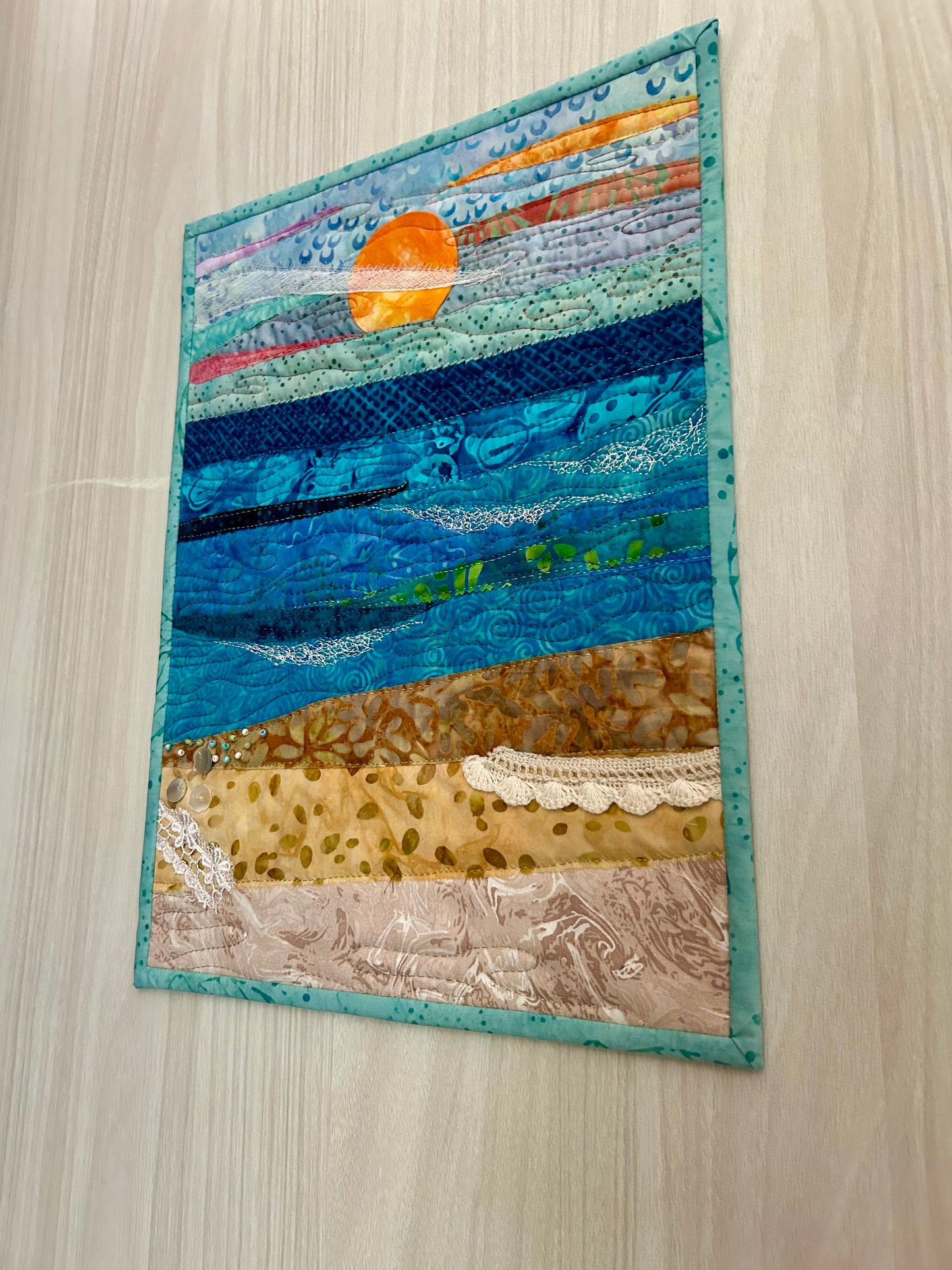 Coastal mini quilt wall hanging in blue and tan