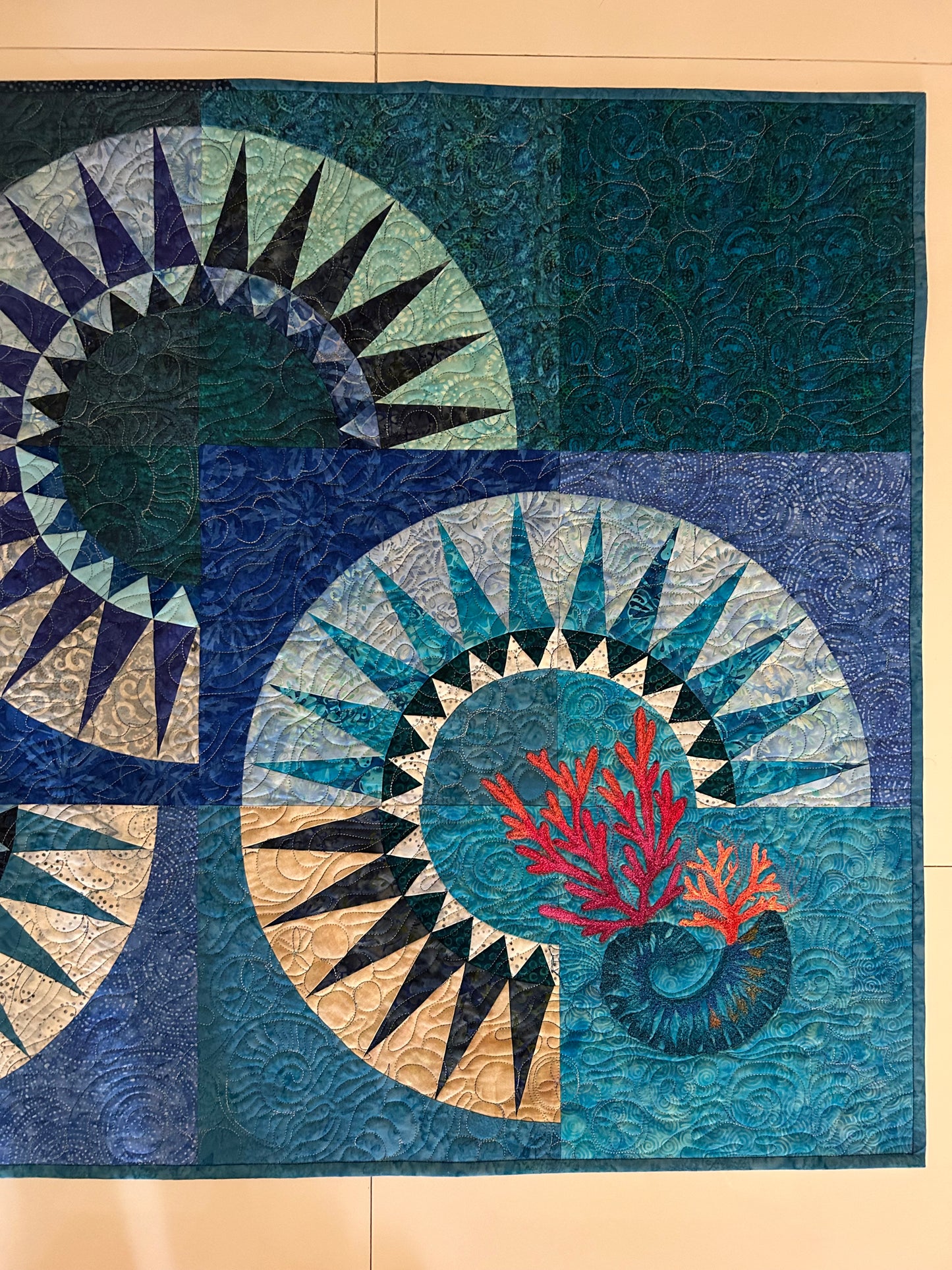 Close-up of coral reef-inspired quilted details