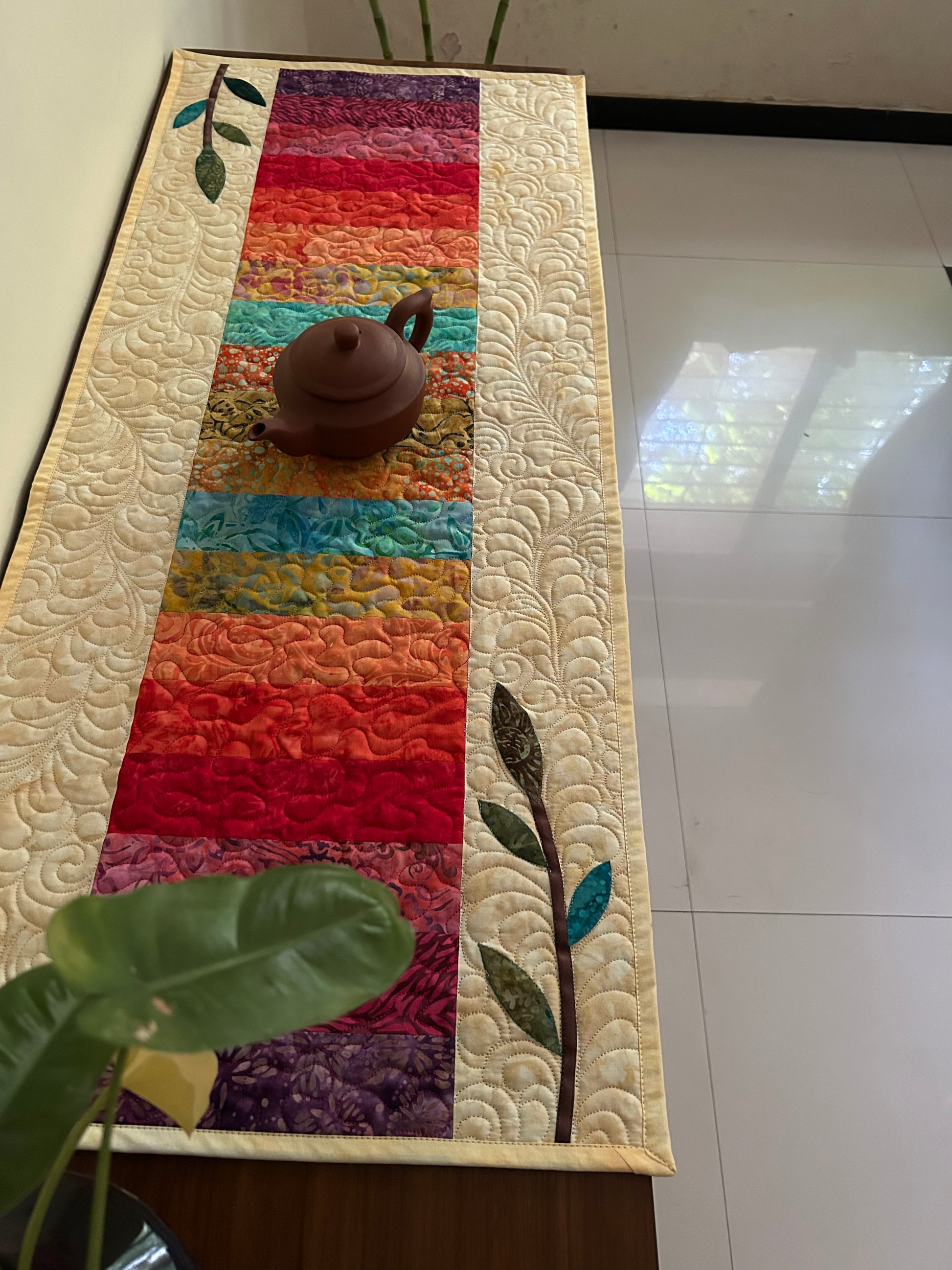 vibrant rainbow table runner on table