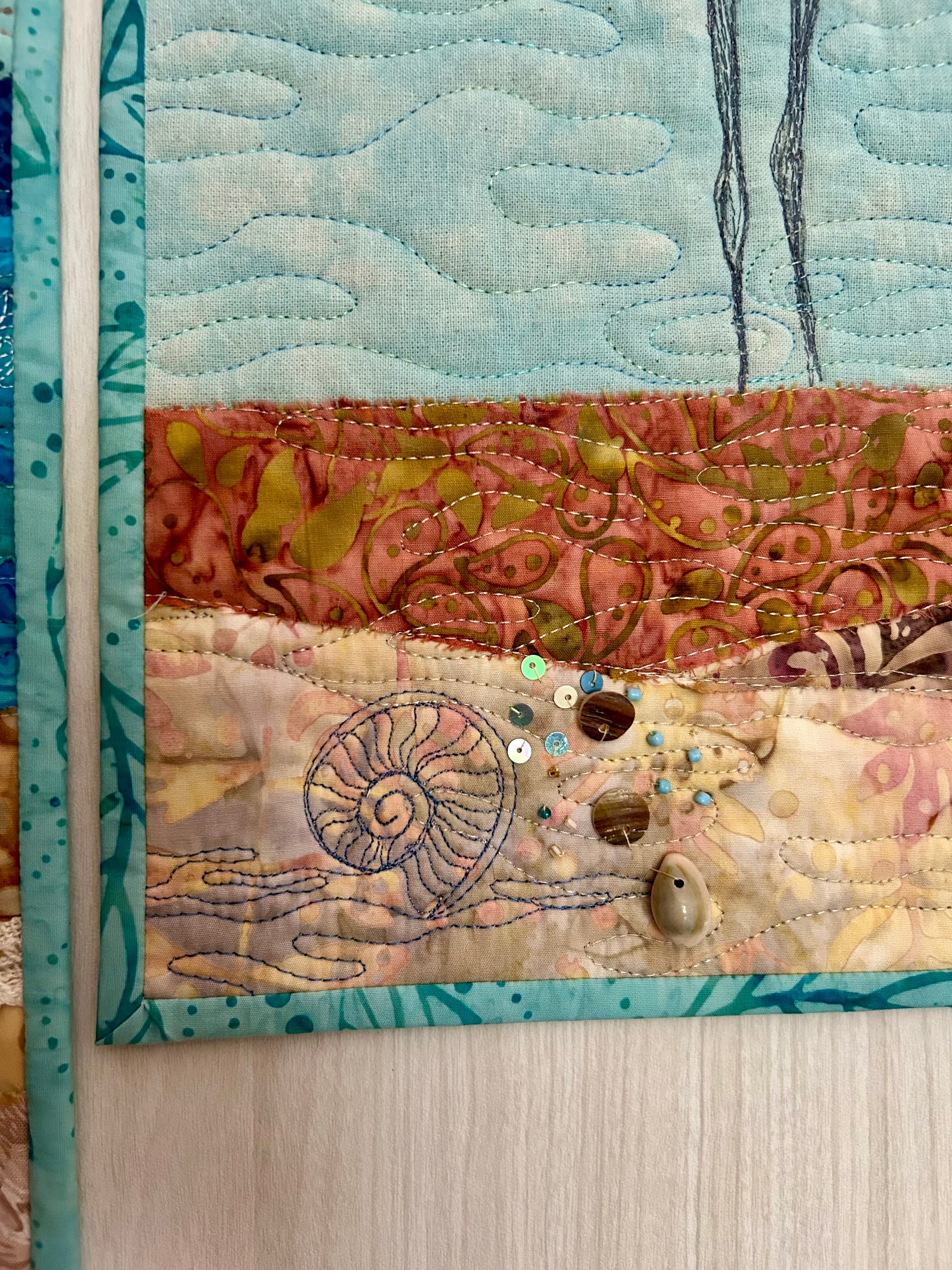 Seascape quilt with detailed thread painting