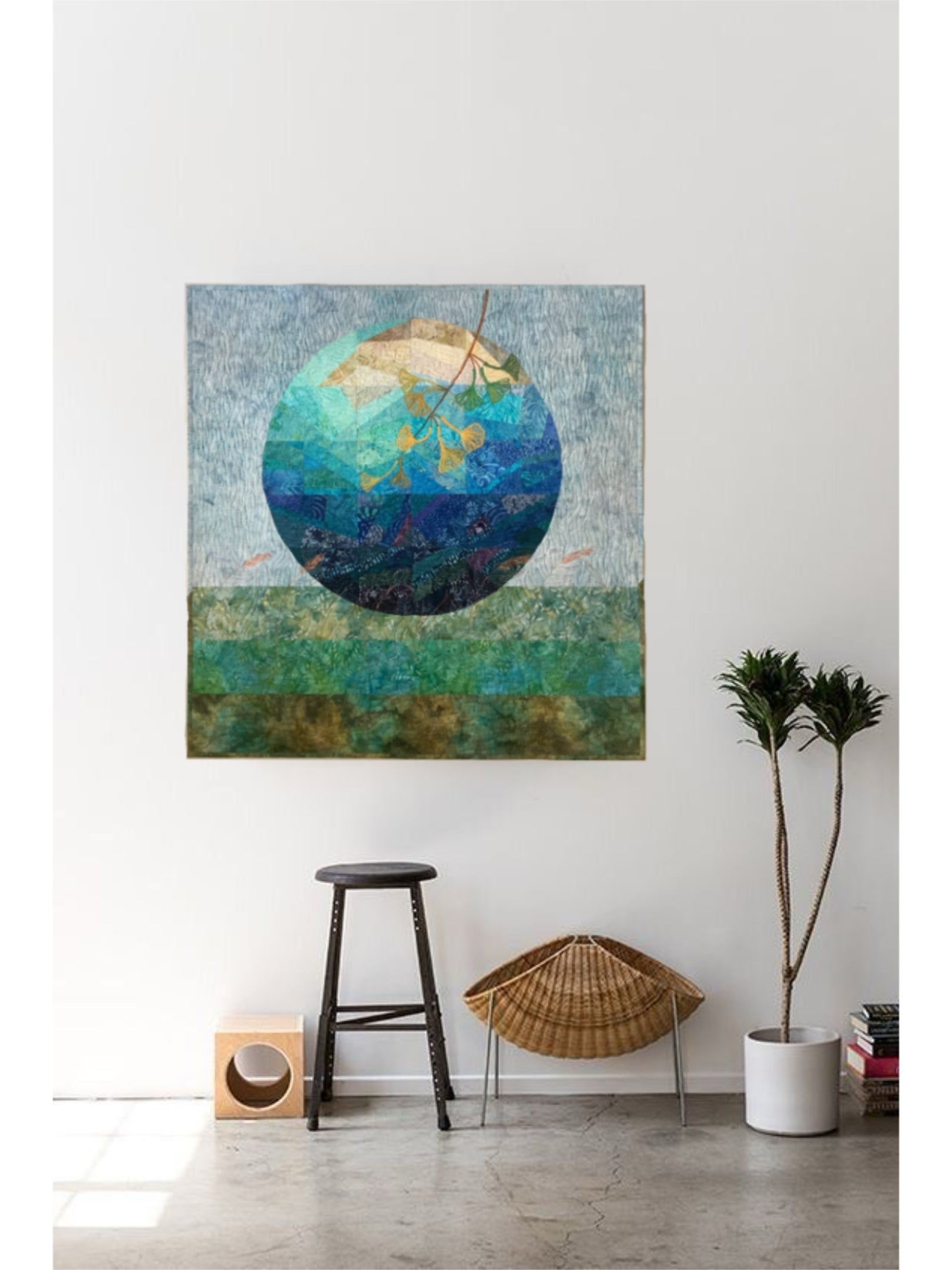 Artistic photo of quilt hanging in minimalist interior.