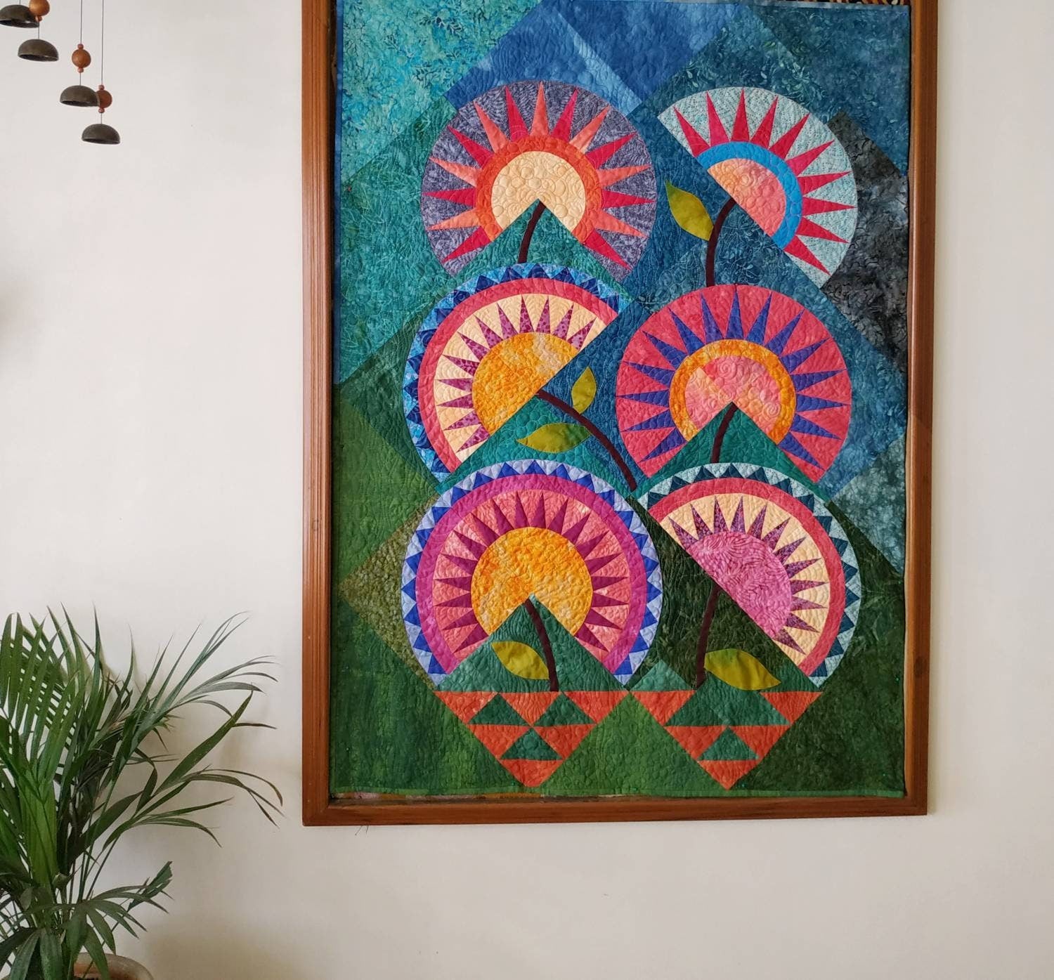 Full view of the 38x50 inch New York Beauty Flower Garden quilt On wall