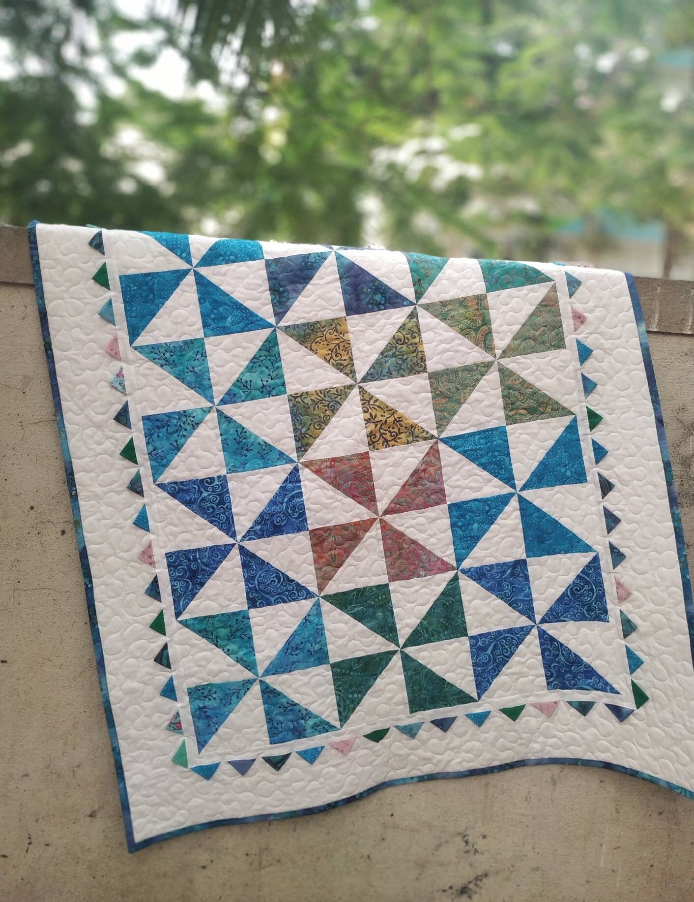 Long shot of pinwheel baby quilt