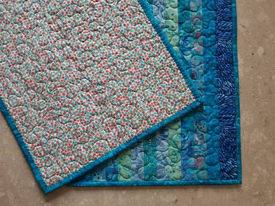 Backside of quilted blue table topper