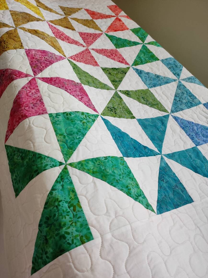 Close up picture of pinwheel baby quilt