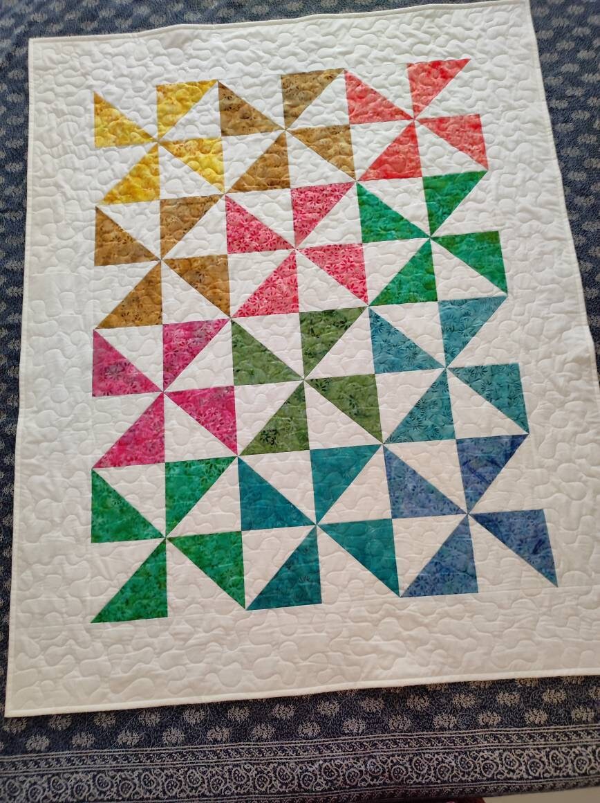 Picture of beautiful pinwheel baby quilt 