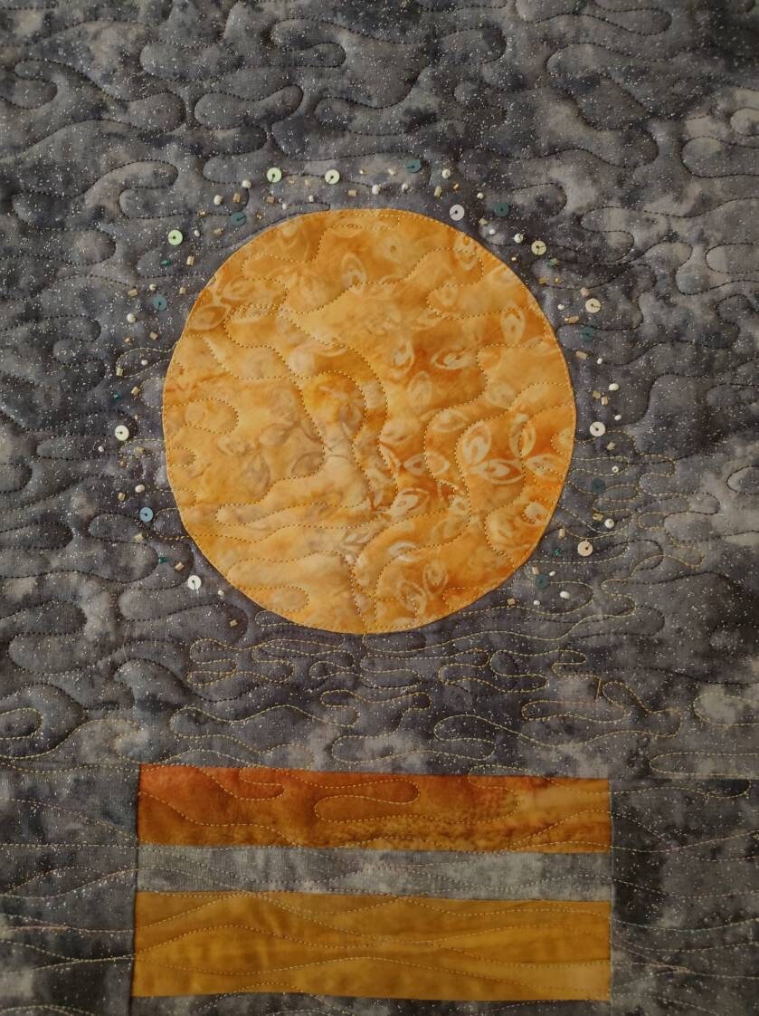 Details of beads and embellishments on Lunar wall art quilt